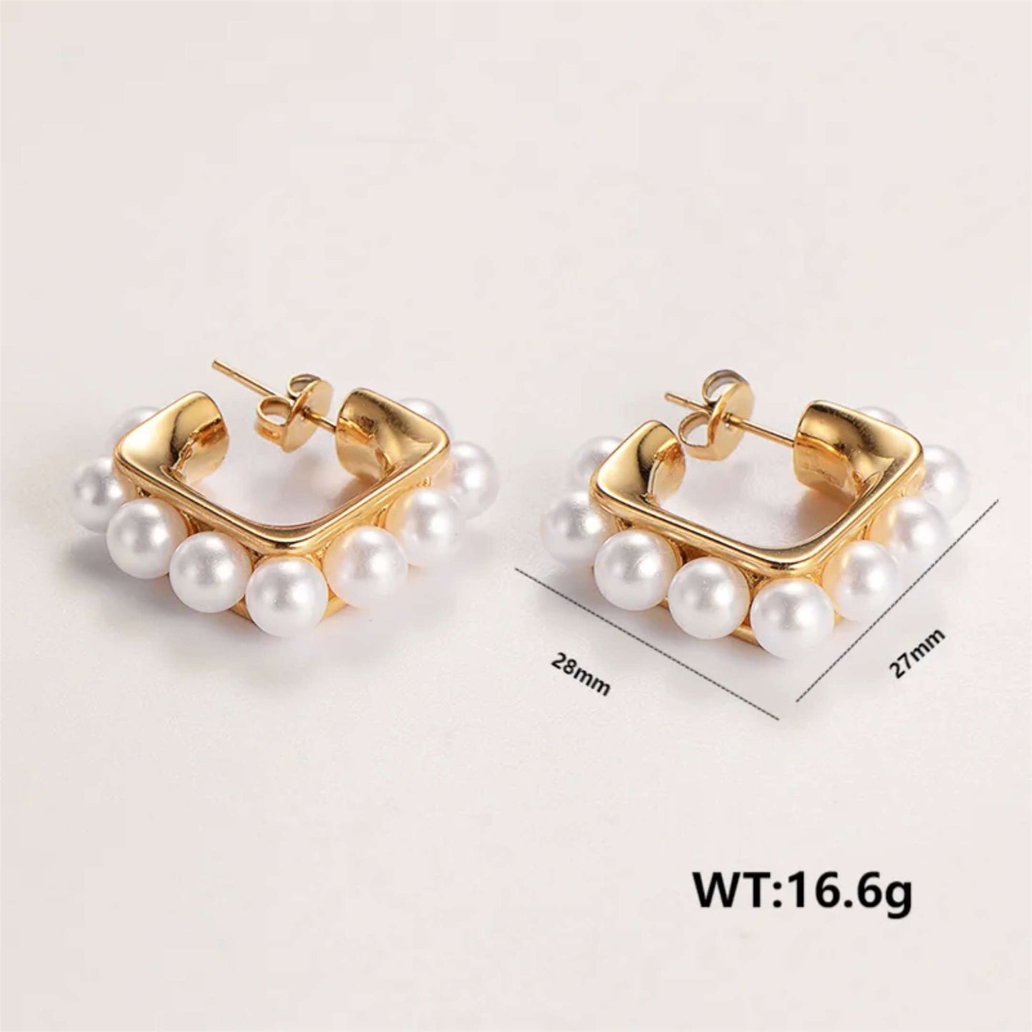 Gold hoop earrings with pearls accents with weight and measurement on a light background