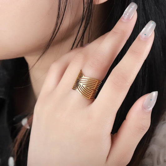 Gold ring on a hand with a blurred background