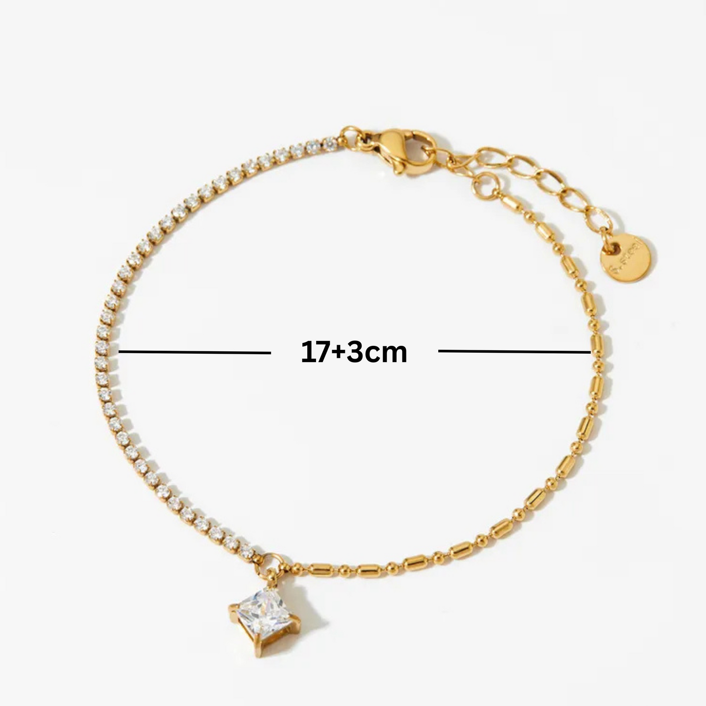 Gold bracelet with a diamond-shaped charm and measurements on a white background