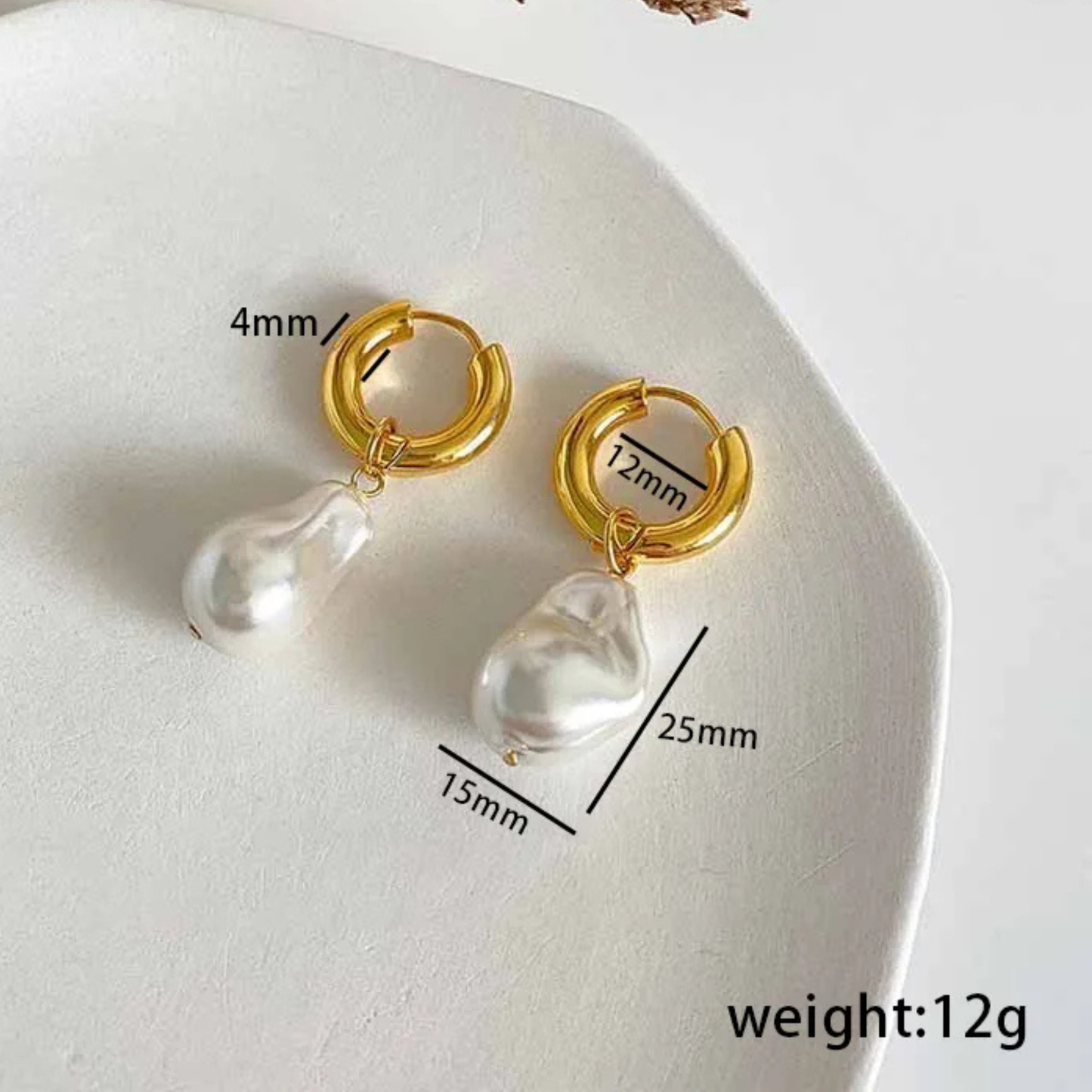 Gold hoop earrings with pearl drops on a white surface, showing measurements and weight.