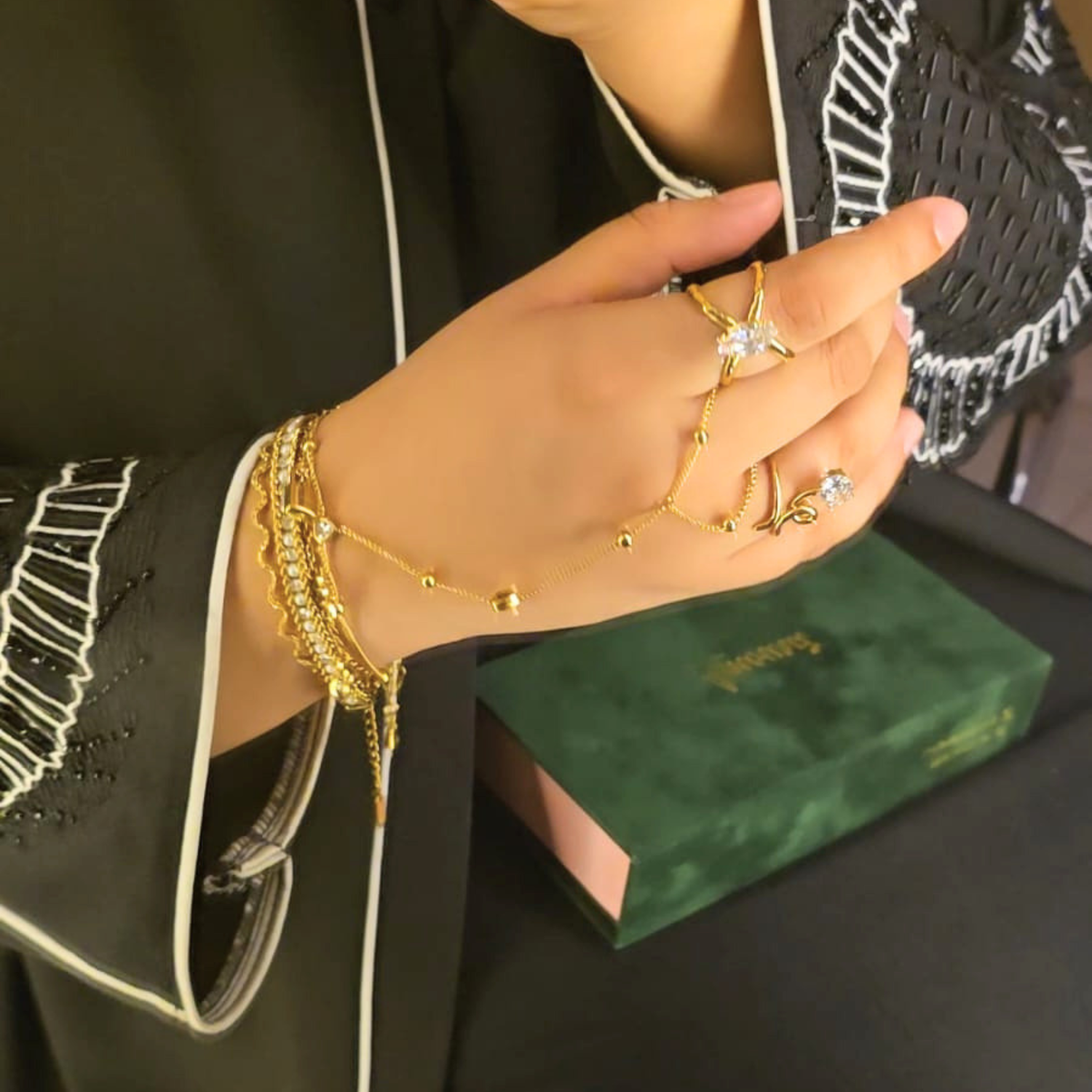 18K gold plated bracelet, handchain and ring styled look by Amoura Jewellers