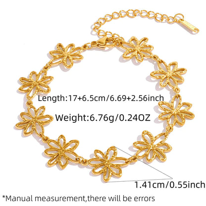 Gold bracelet with floral designs and measurements on a white background