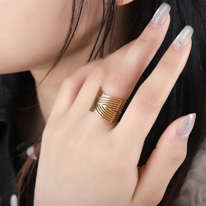 Gold ring on a hand with a blurred background