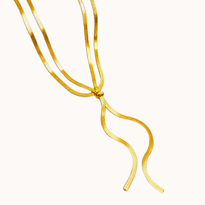 Gold necklace on a white background