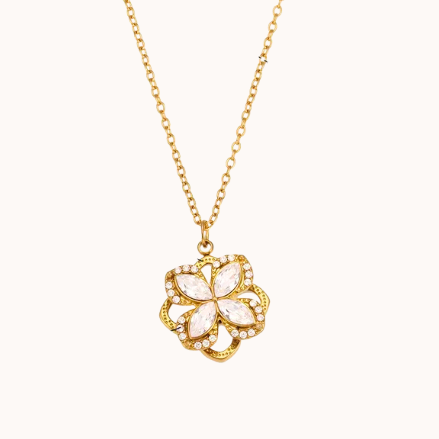 Gold necklace with a floral pendant on a white background