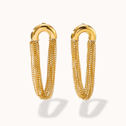 Pair of gold chain hoop earrings on a white background