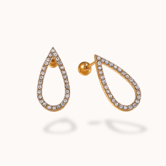 Gold teardrop earrings with clear gemstones on a white background