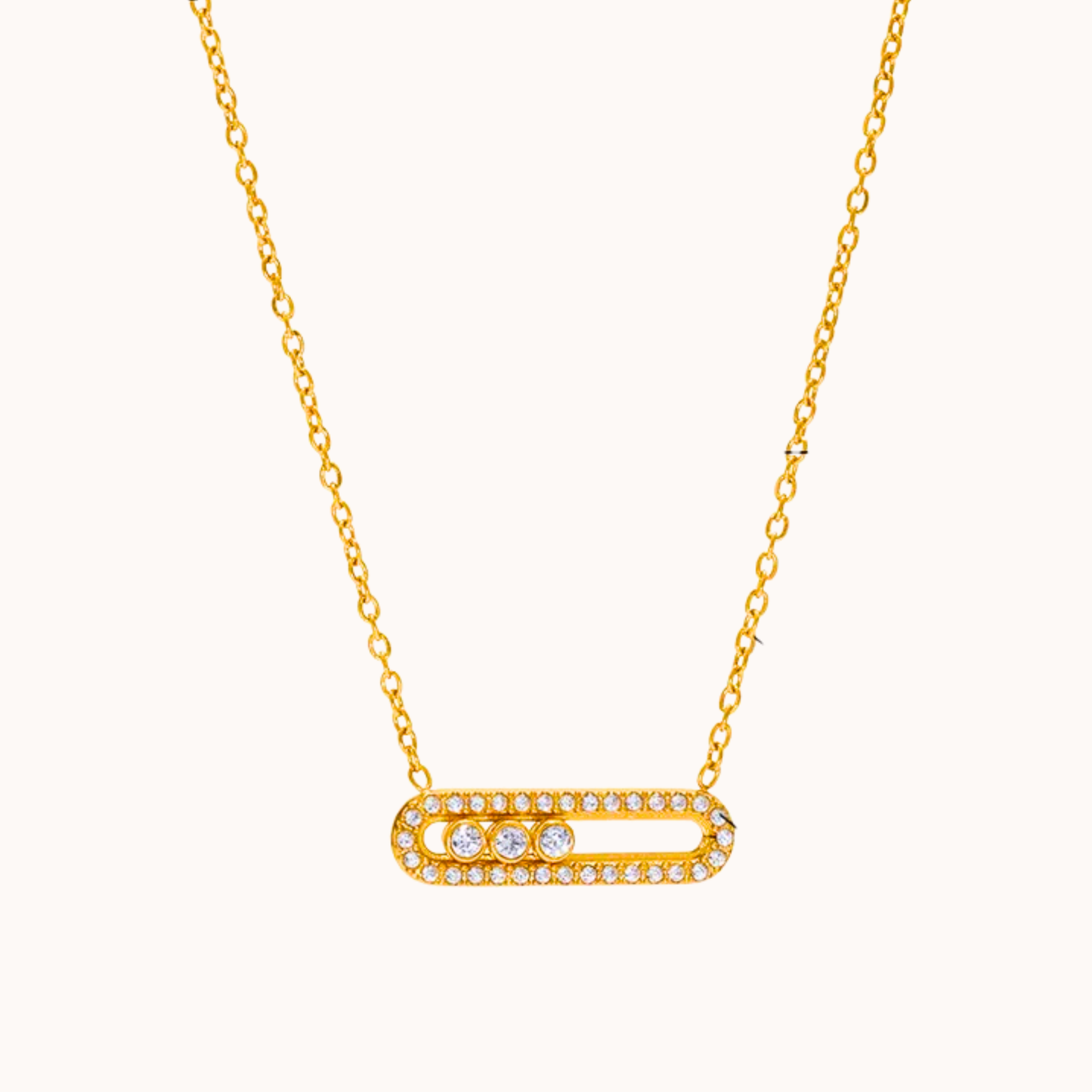 Gold necklace with a bar-shaped pendant on a white background