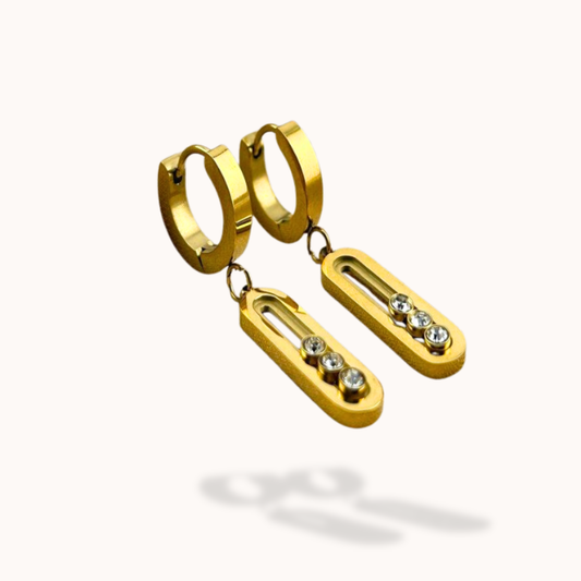 Gold hoop earrings with dangling rectangular pendants on a white background