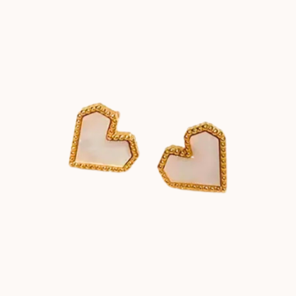 Heart-shaped earrings with gold frame on a white background