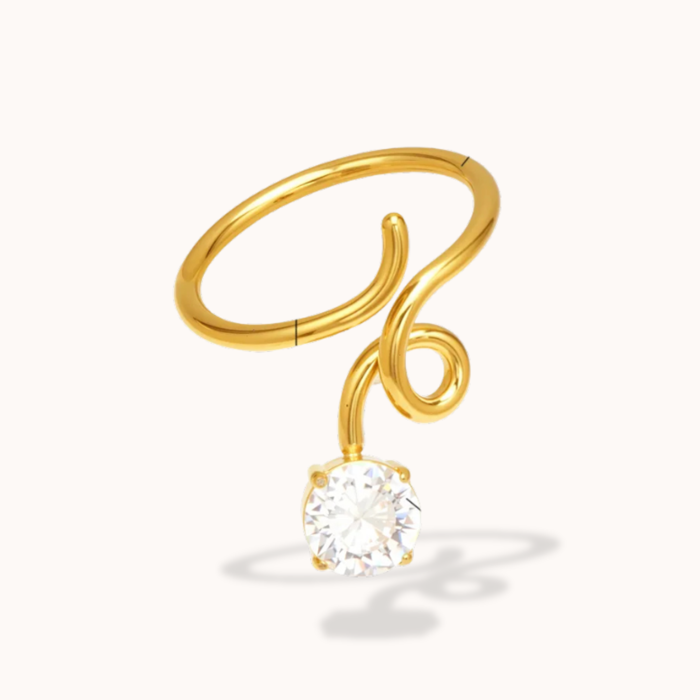 Gold ring with a diamond on a white background