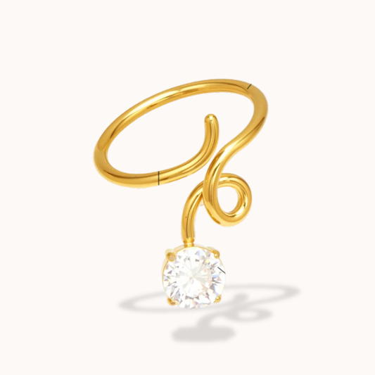 Gold ring with a diamond on a white background