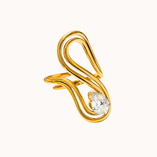 Gold ring with a diamond on a white background