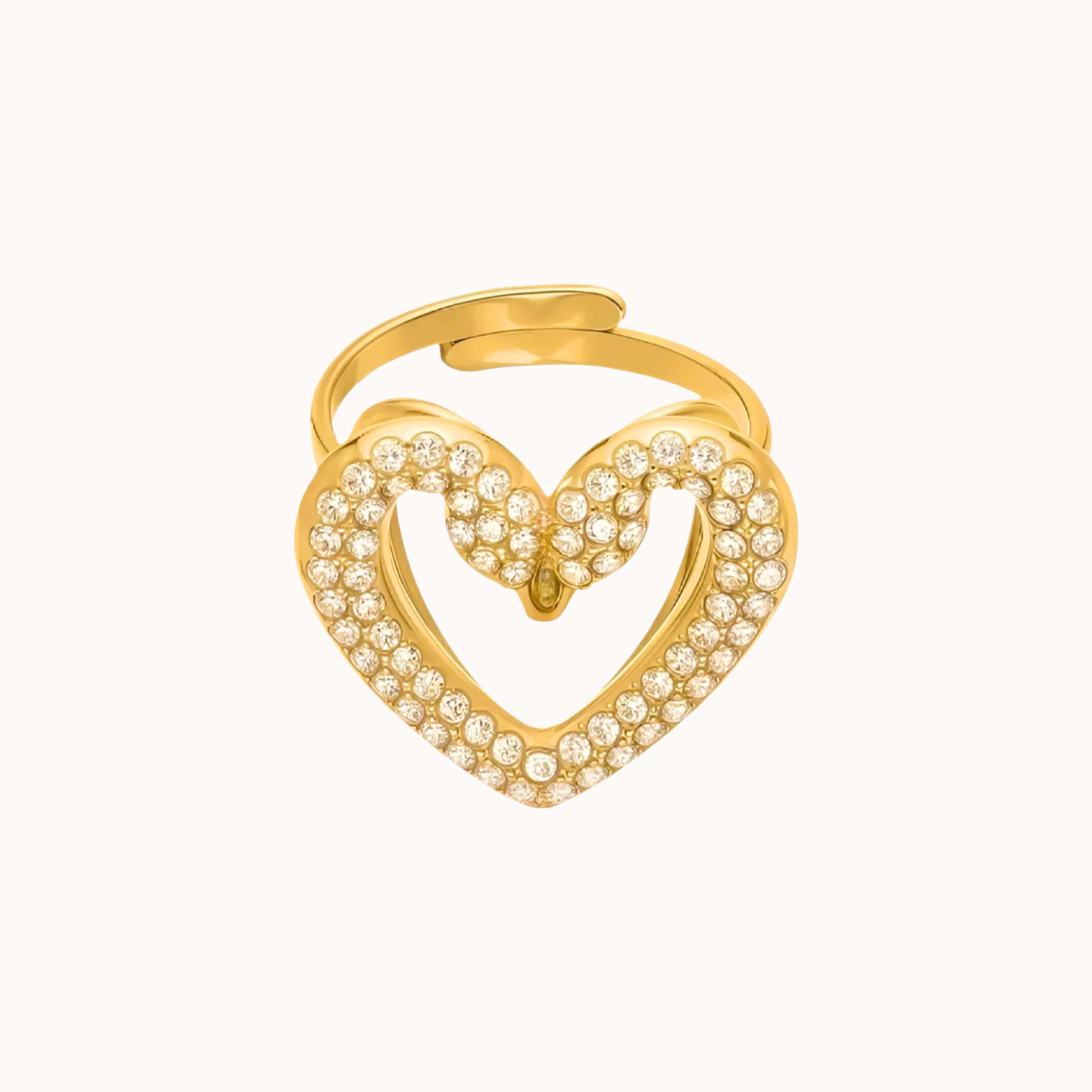 Gold swan heart-shaped ring with embedded stones on a white background
