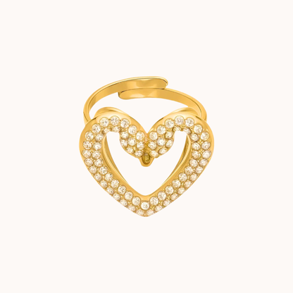 Gold swan heart-shaped ring with embedded stones on a white background
