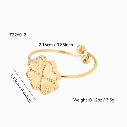 Gold bracelet with shell design and measurements on a white background