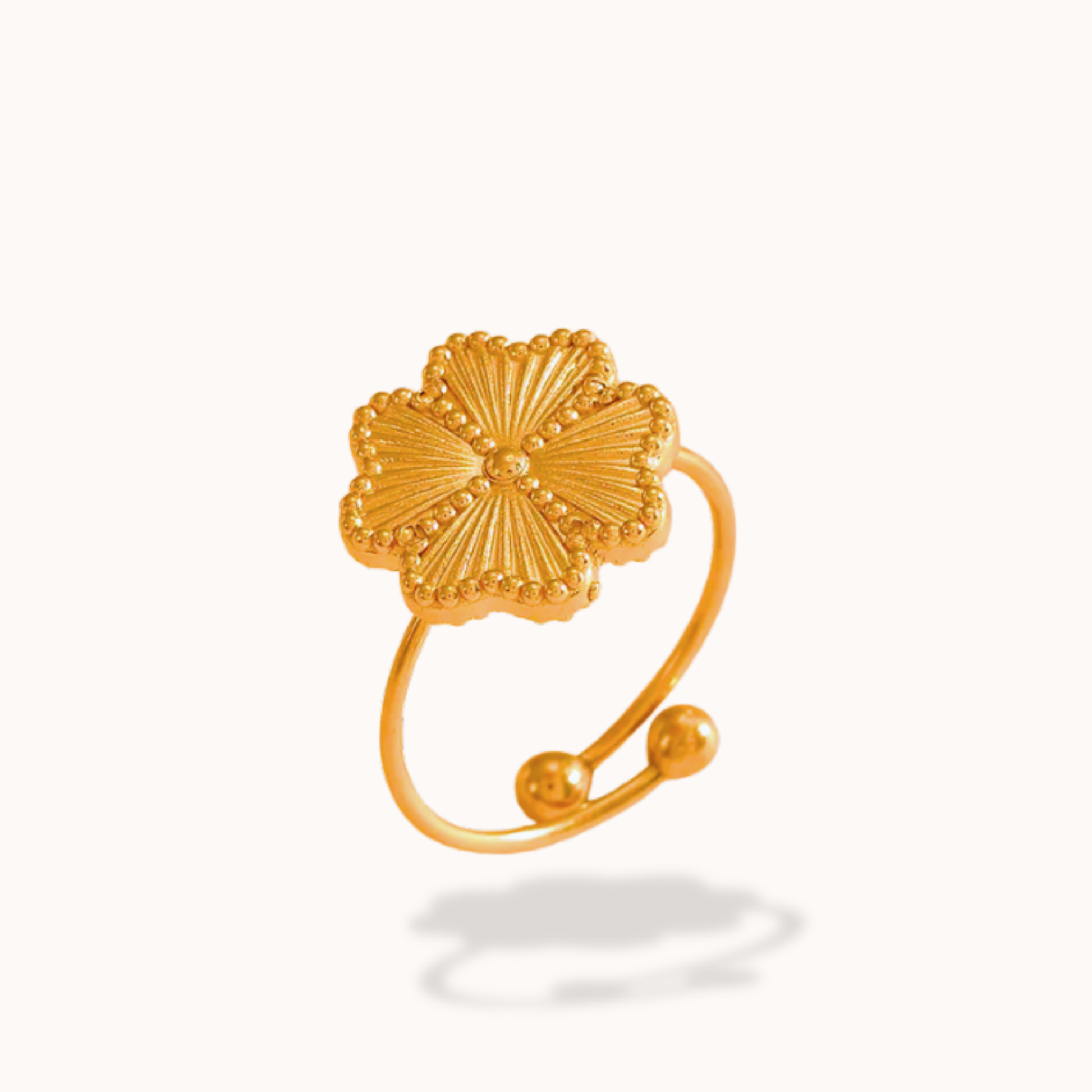 Gold openwork ring on a white background