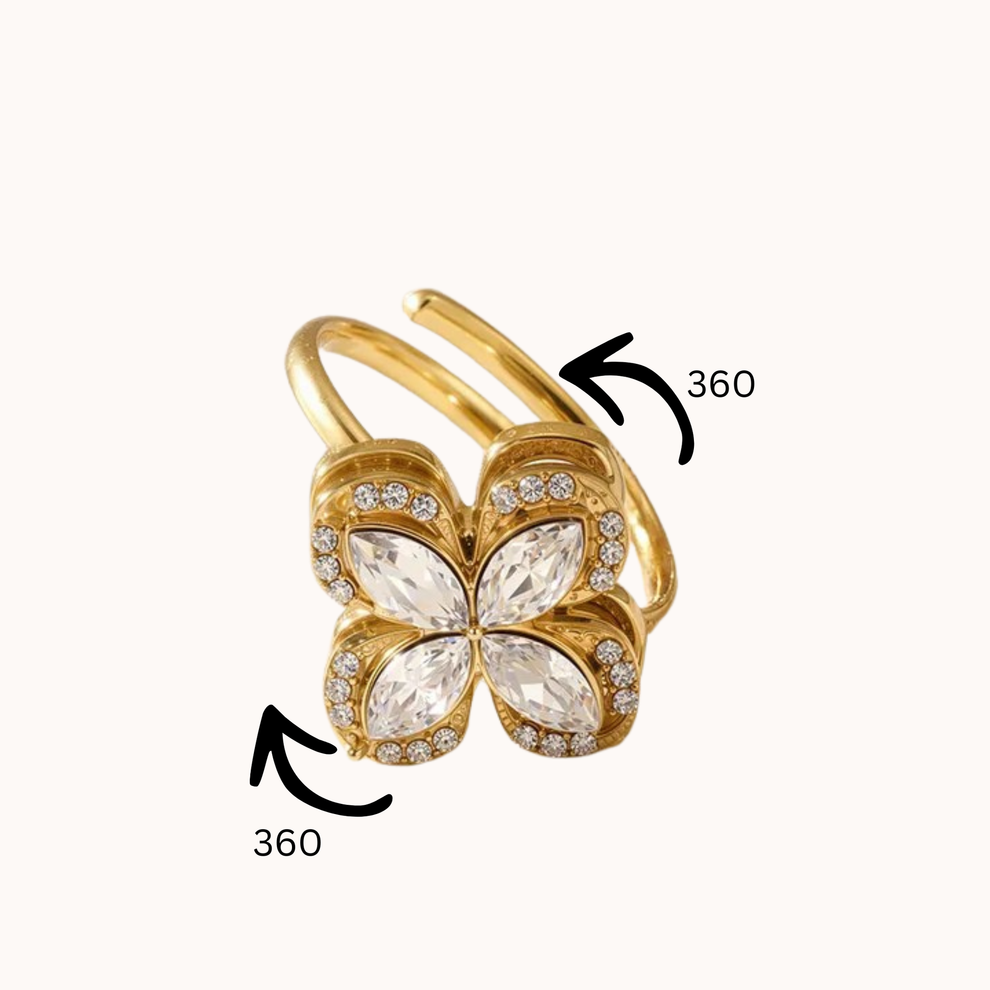 Gold ring with a floral design on a white background