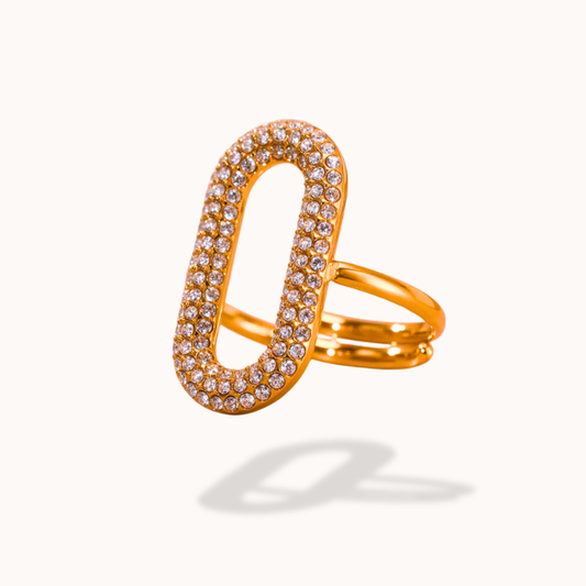 Gold ring with diamond accents on a white background