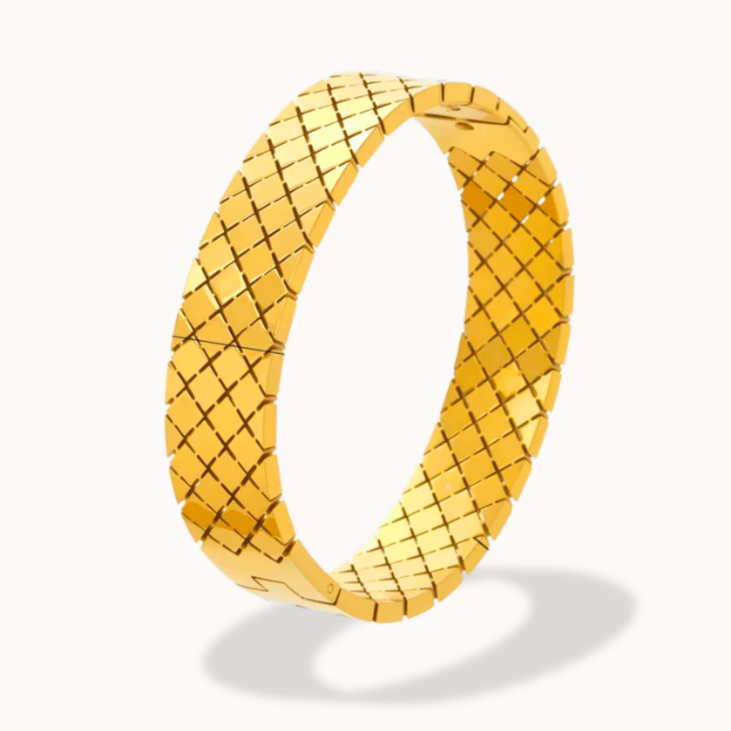 Gold woven ring on a white background