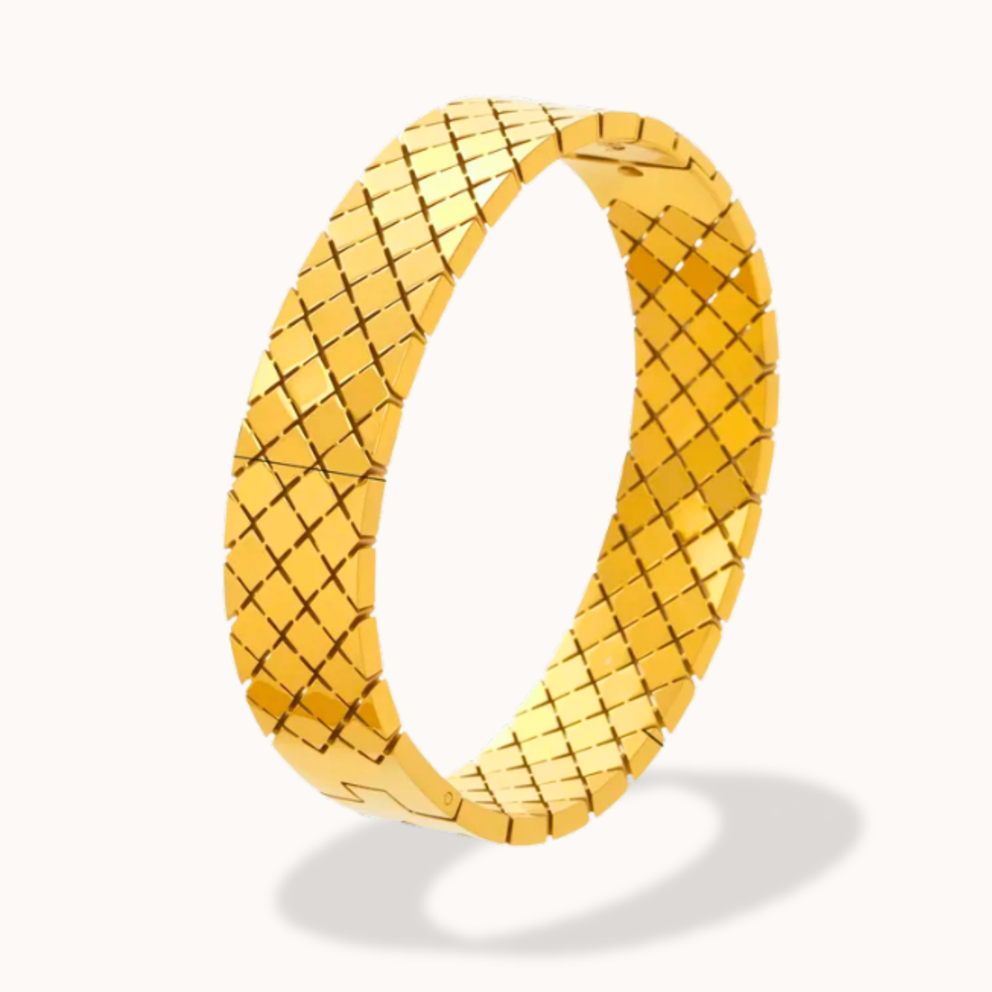 Gold woven ring on a white background