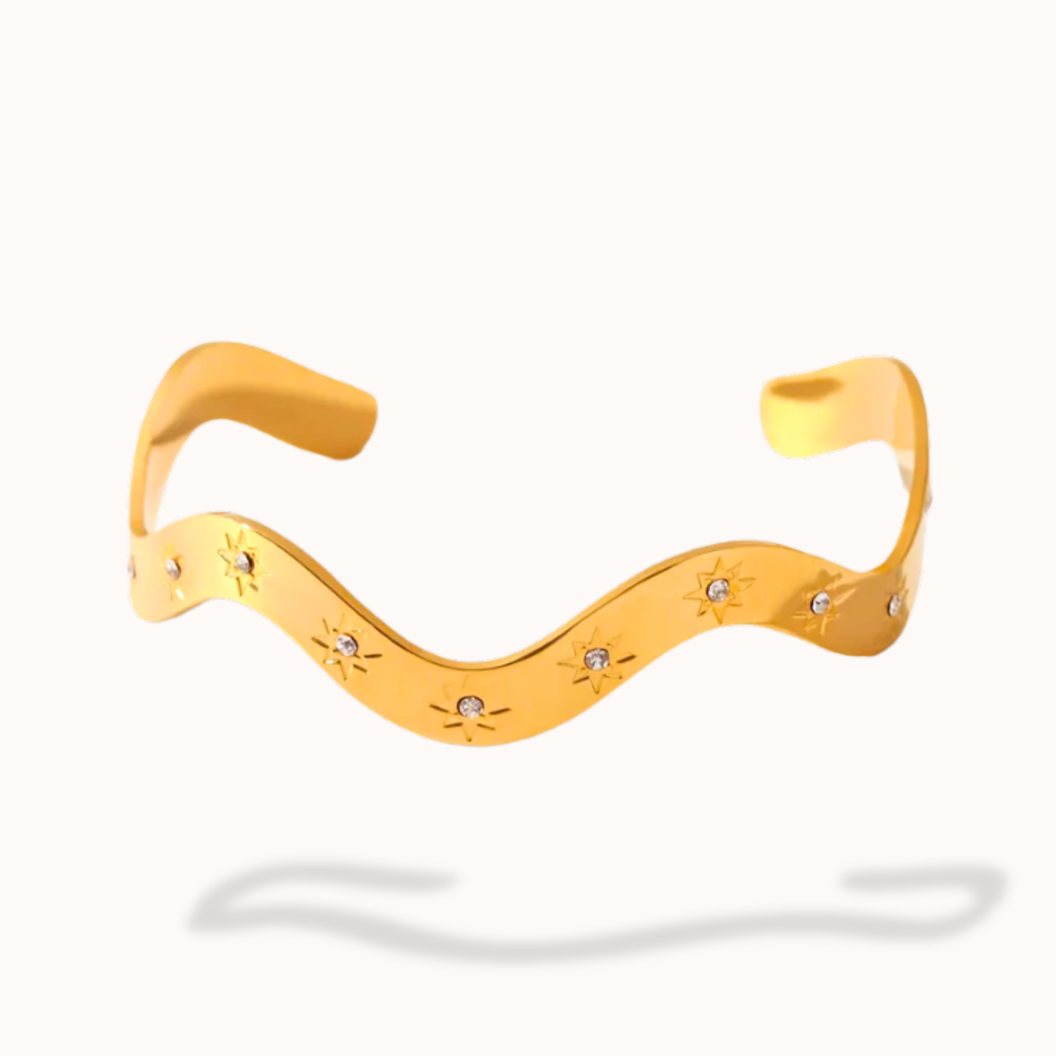 Yellow wavy necklace with small round embellishments on a white background