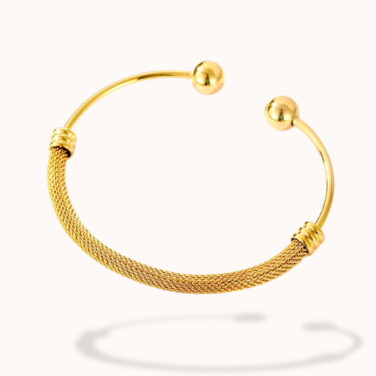 Gold bracelet on a white background