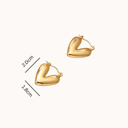 Gold heart-shaped hoop earrings with measurements on a white background