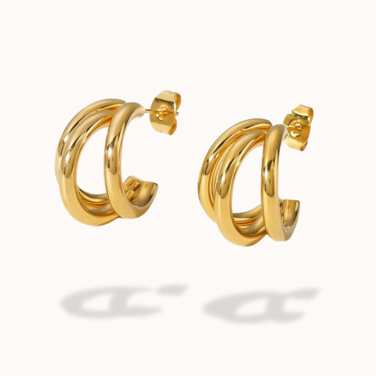 Gold hoop earrings on a white background