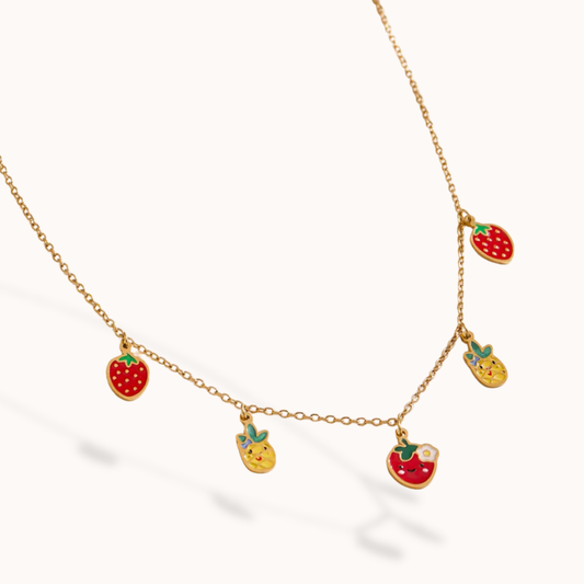 Necklace with fruit-shaped pendants on a white background