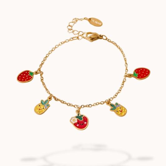 Gold bracelet with fruit-themed charms on a white background