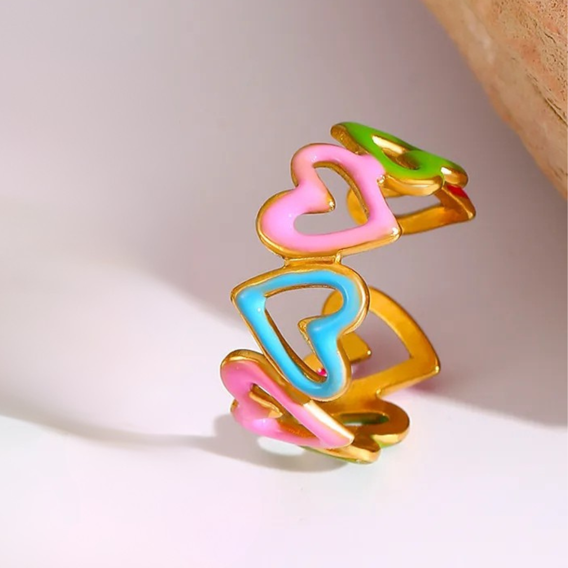 Colorful heart-shaped hair clips on a light background
