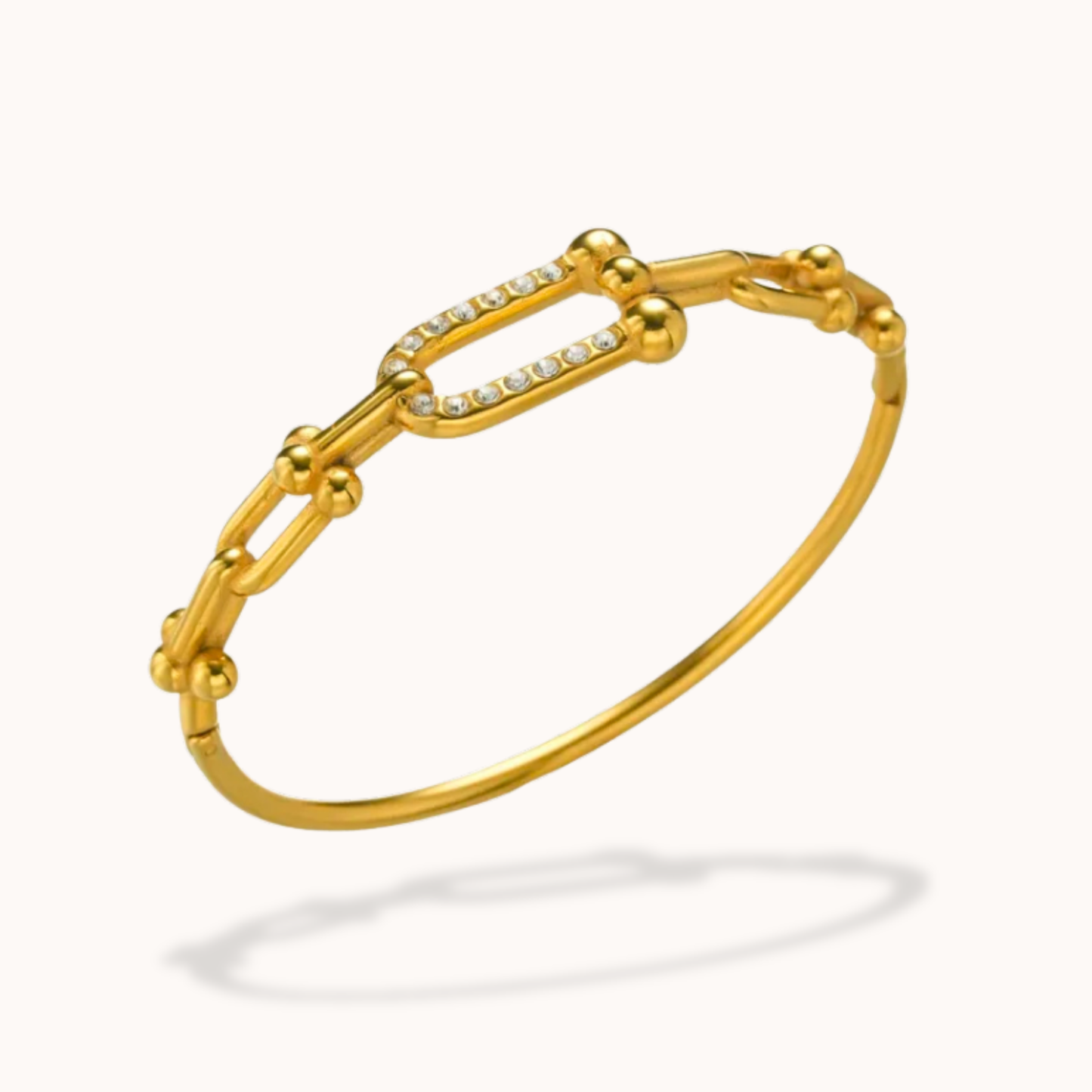 Gold bracelet with diamond accents on a white background