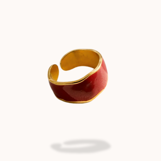 Gold and red ring on a white background
