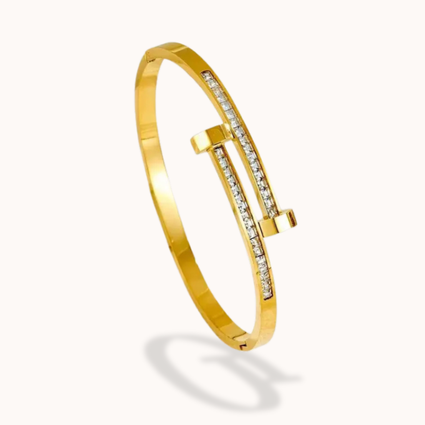Gold bracelet with diamond accents on a white background