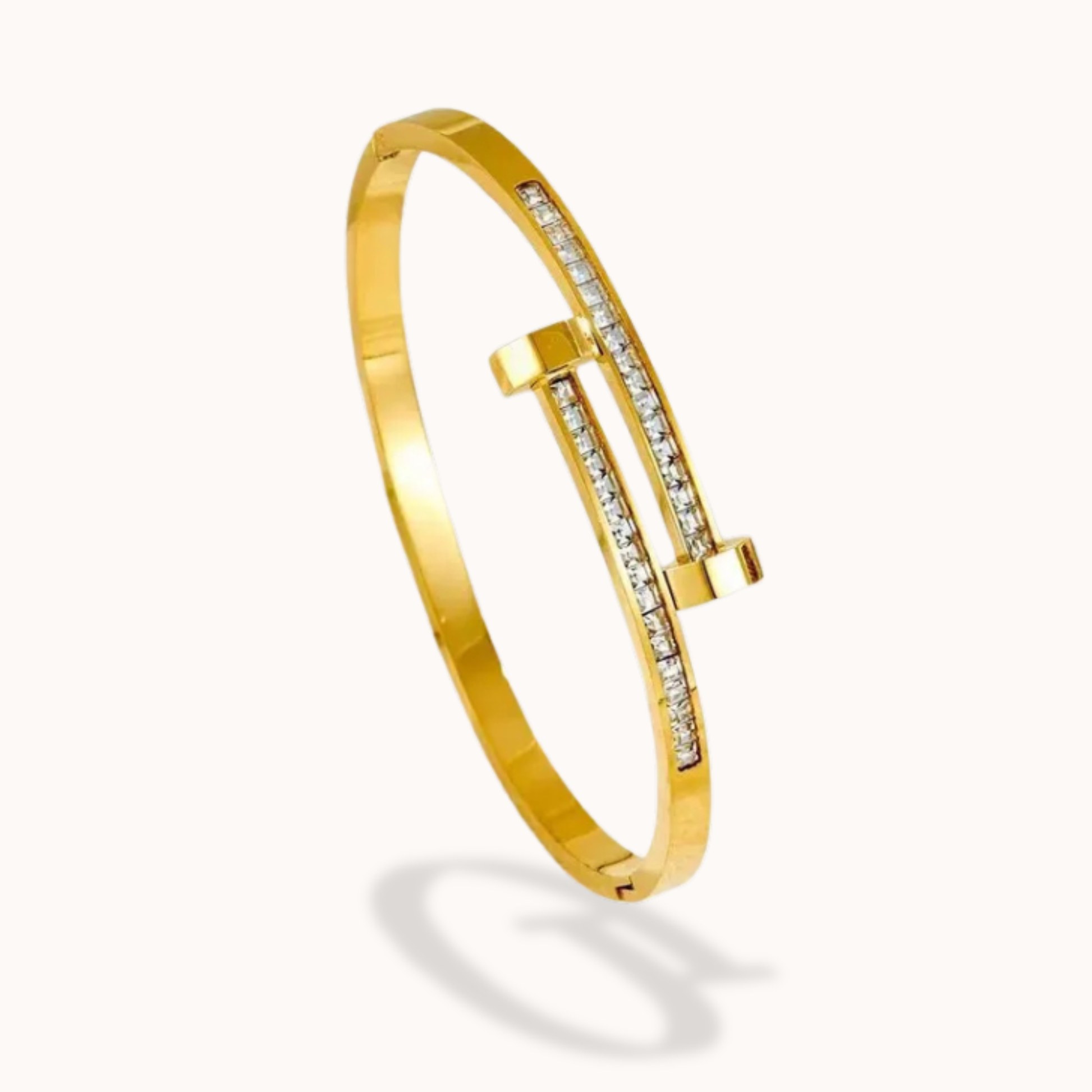 Gold bracelet with diamond accents on a white background