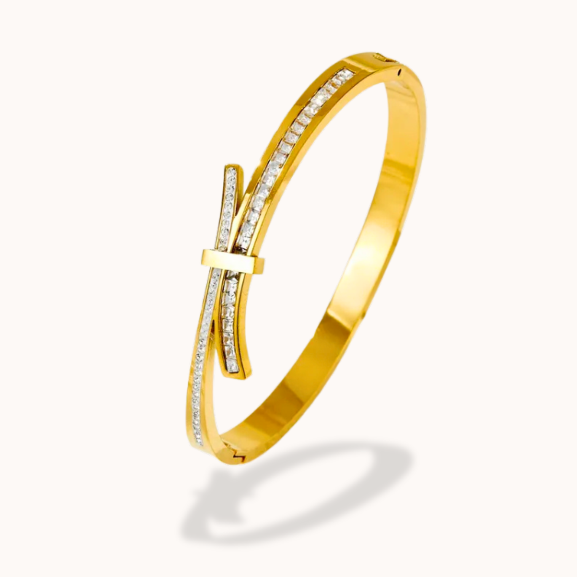 Gold bracelet with diamond accents on a white background