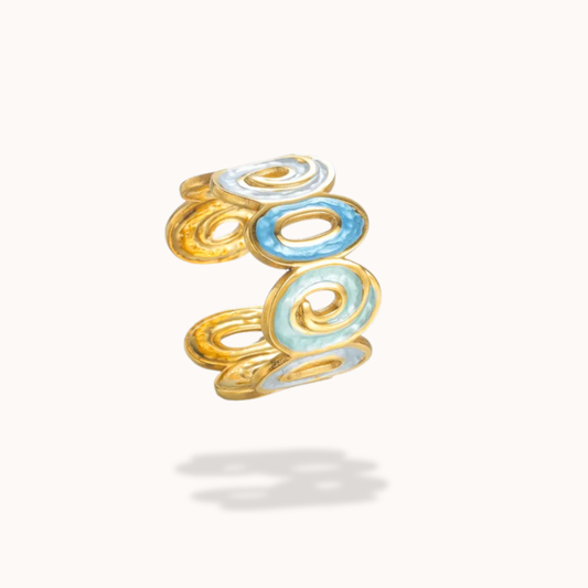 Gold and blue ring on a white background