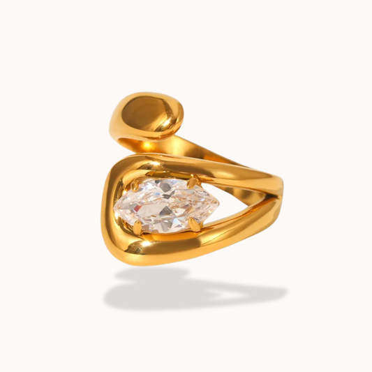 Gold ring with a diamond on a white background