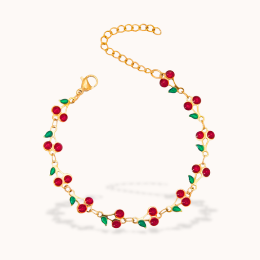 Gold bracelet with red cherry Enamel on a white background