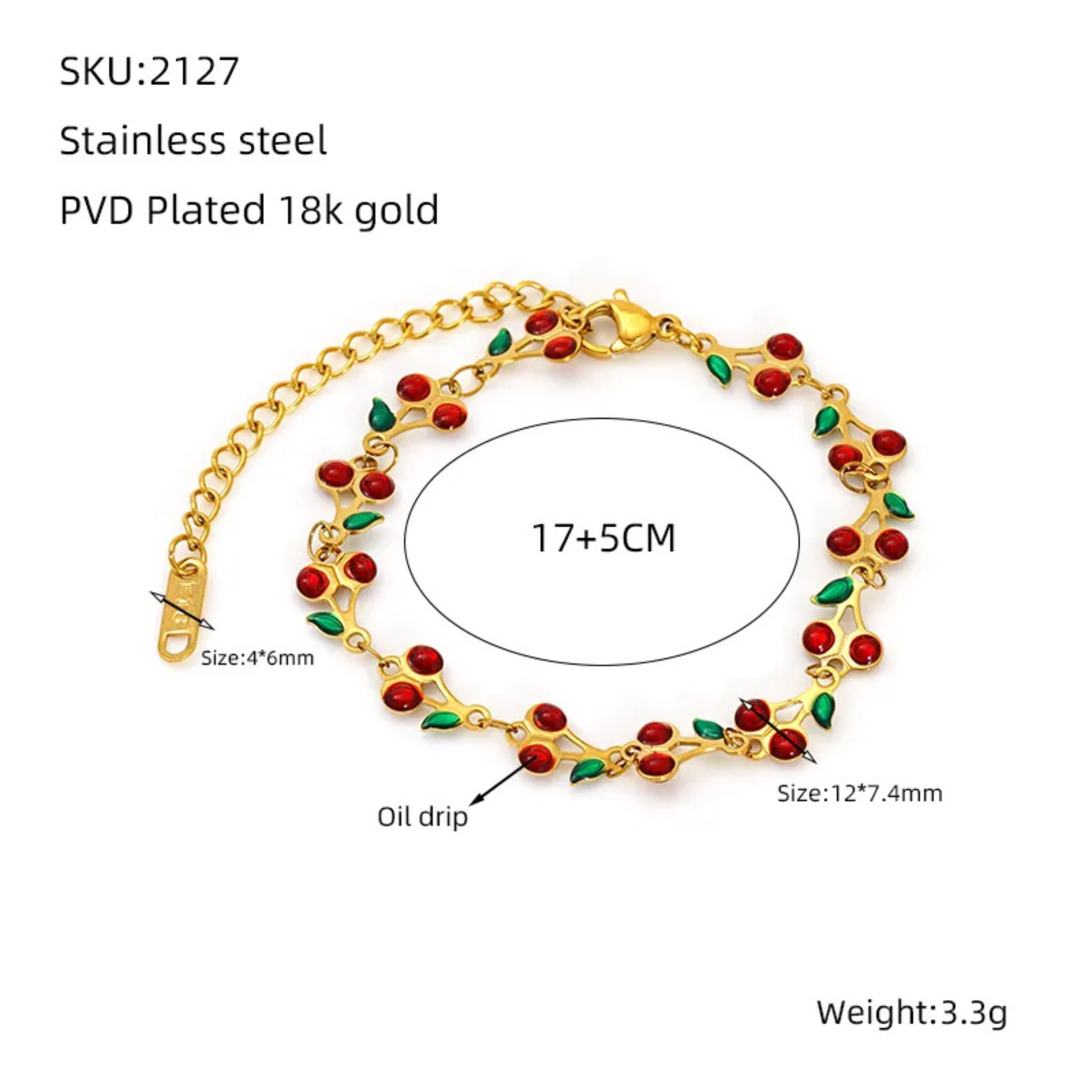 Gold bracelet with red cherry and green leaf on a white background