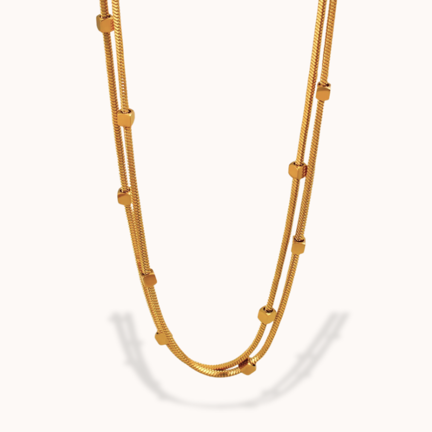 Gold necklace on a white background