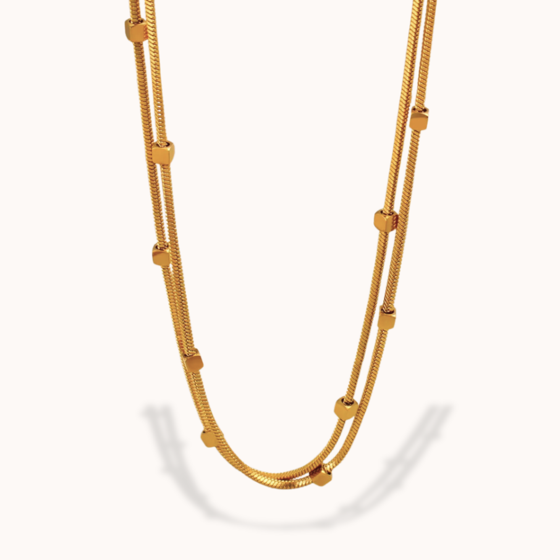 Gold necklace on a white background