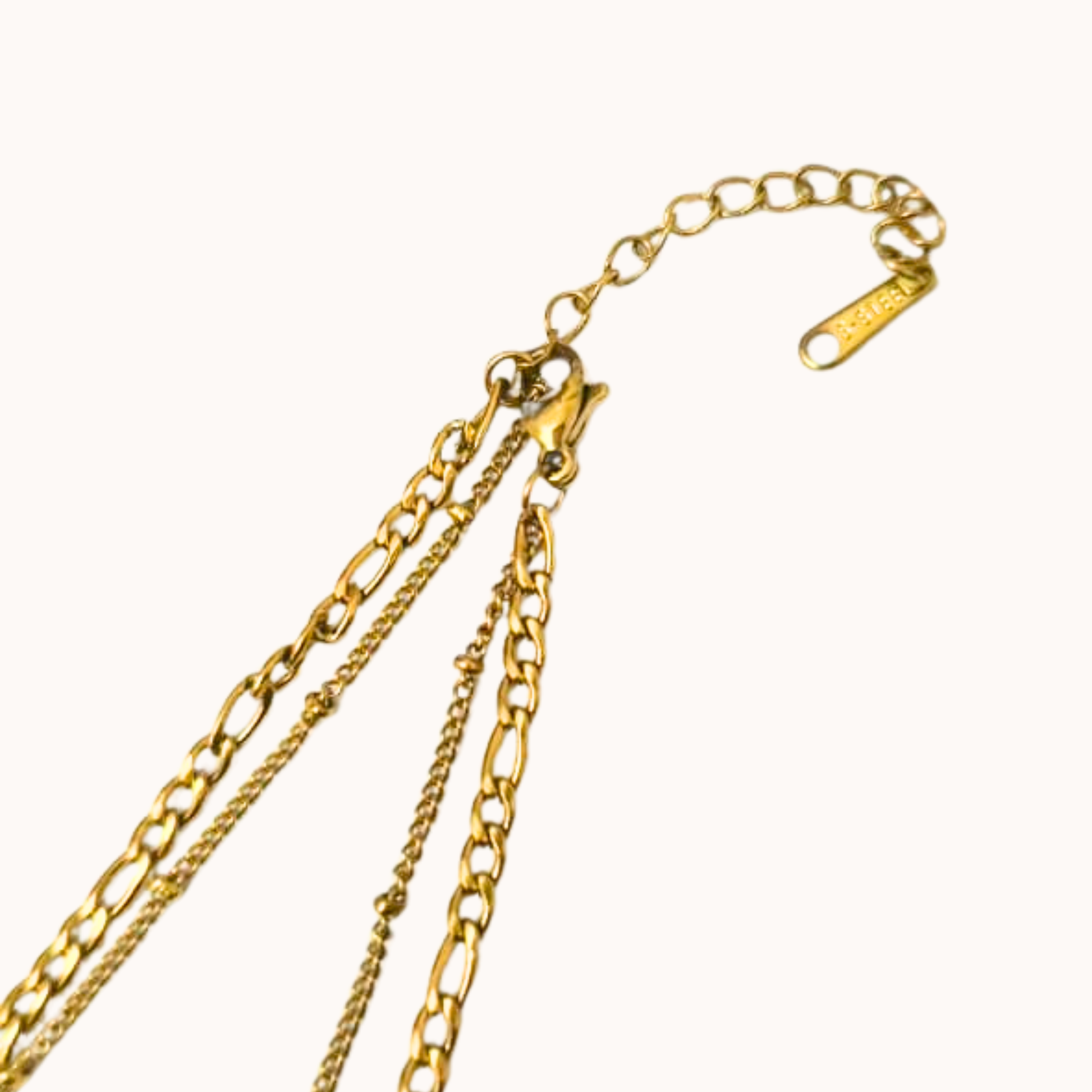 Gold chain necklace on a white background