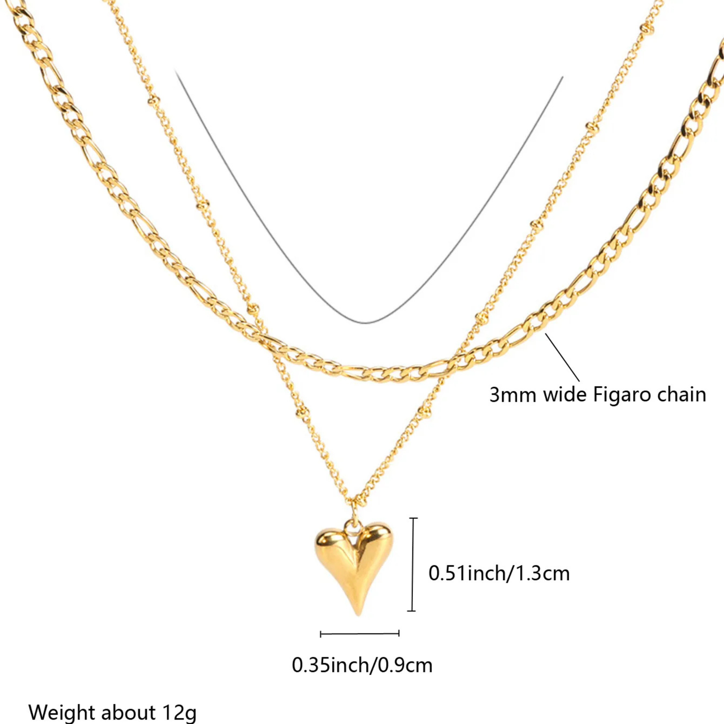 Gold heart pendant necklace with Figaro chain on a white background