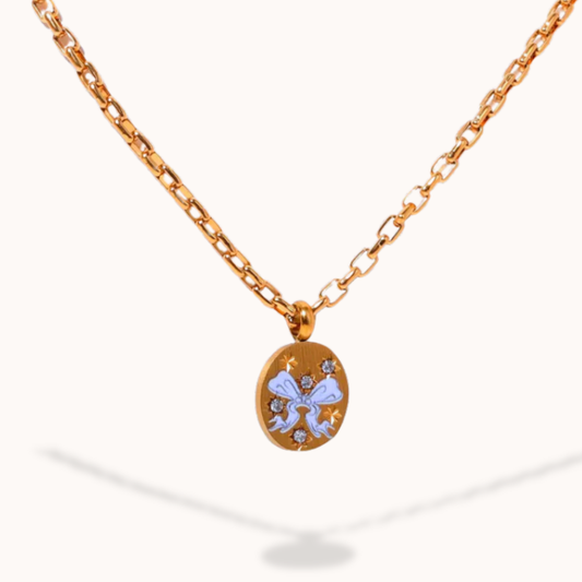 Gold necklace with a pendant on a white background