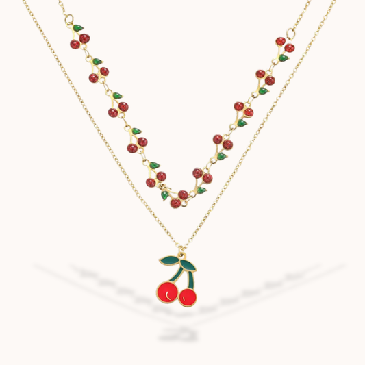 Necklace with cherry pendant on a white background