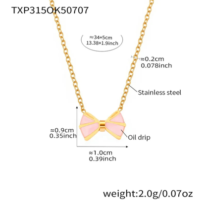 Gold necklace with pink bow pendant and measurement details on a white background