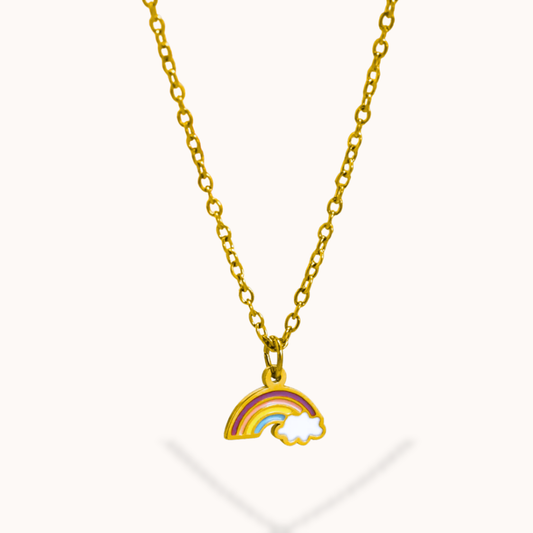 Gold necklace with a rainbow and cloud pendant on a white background