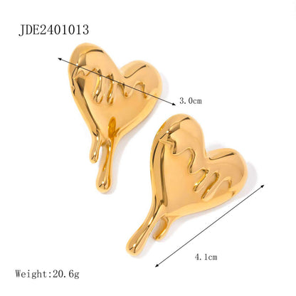 Gold drip heart-shaped earrings with measurements on a white background